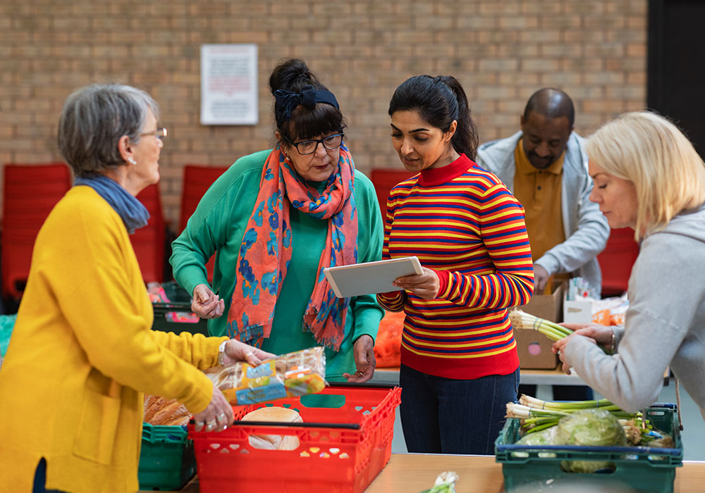 People organizing and donating to a food drive