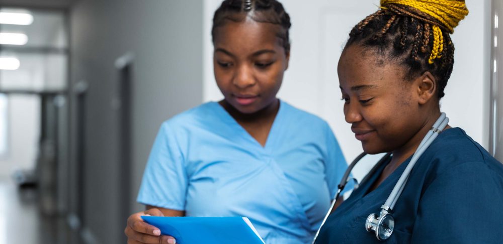 Nurses reviewing a patient chart